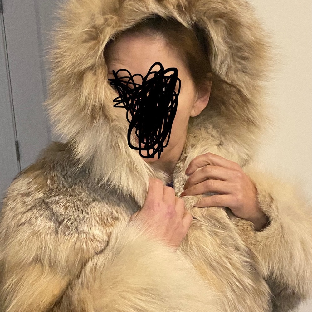 Russian Linx fur from Saks Boston. Very stylish, mid thigh length, hooded coat